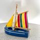 Wooden bathtub sailboat, perhaps a Tirot.
