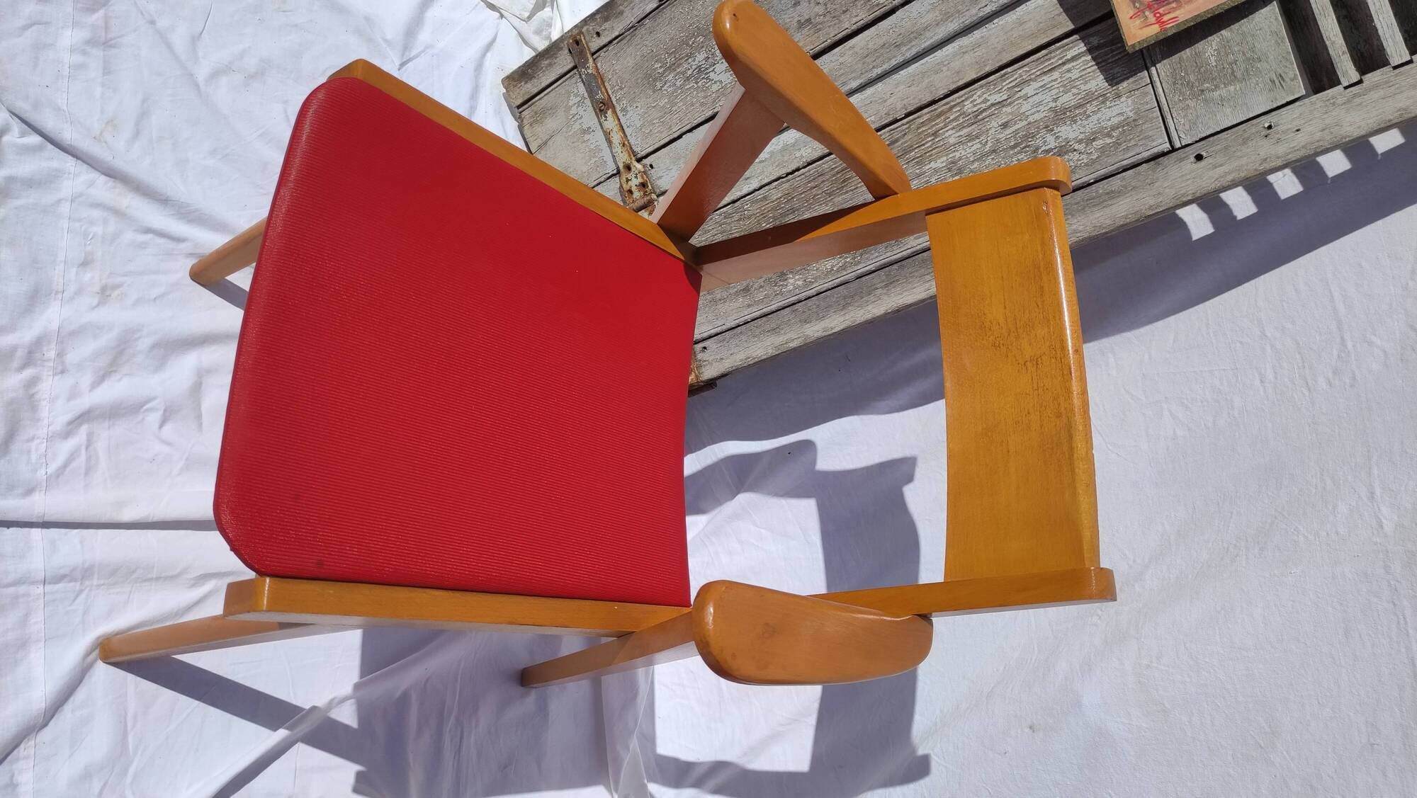 Pair of wooden armchairs and skaï foot compass of the 50s