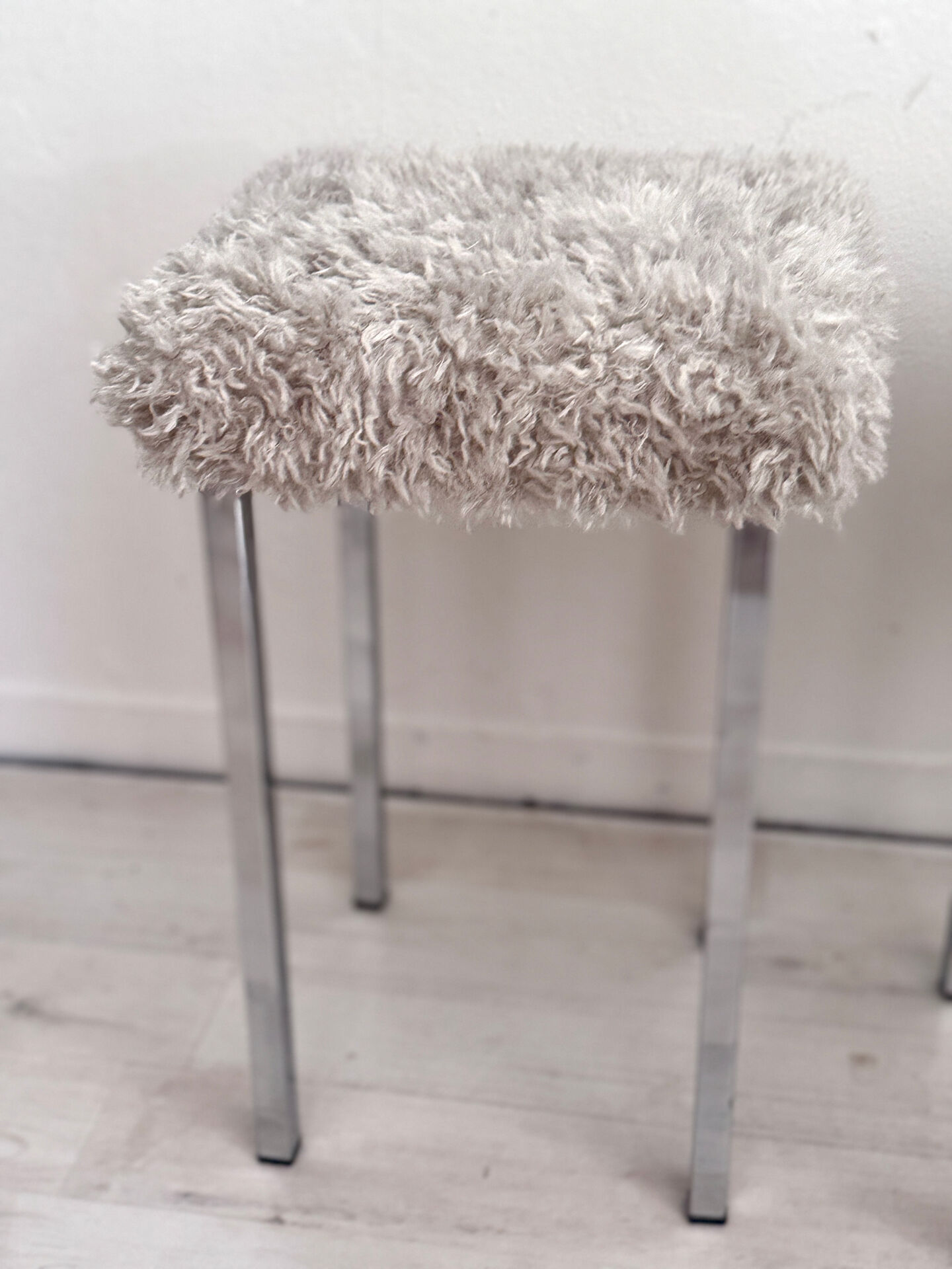 Set of two vintage chrome stools with fluffy upholstery