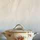 Antique porcelain soup bowl with floral decoration and golden border