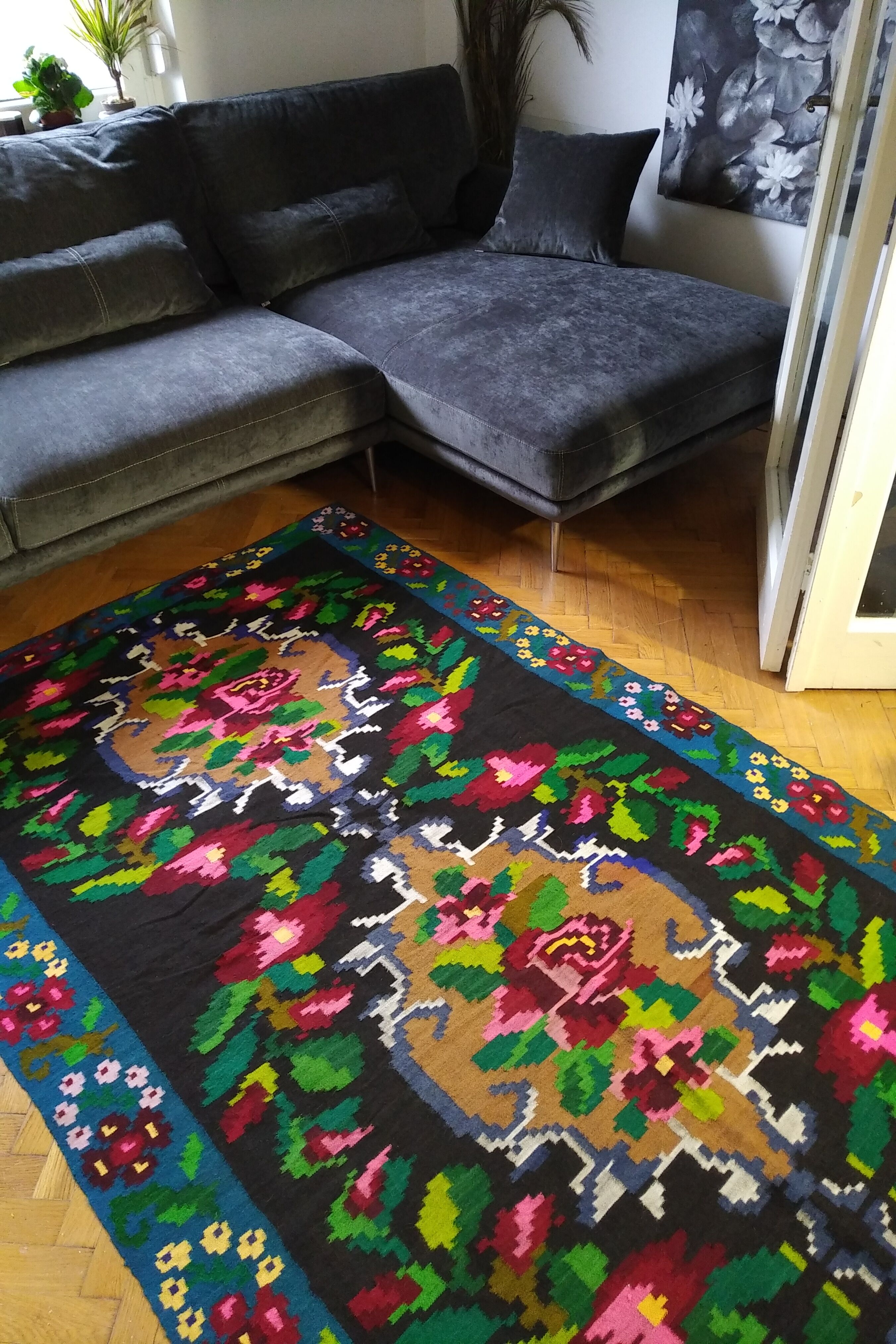 Romanian floral runner rug on blue background