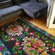 Romanian floral runner rug on blue background