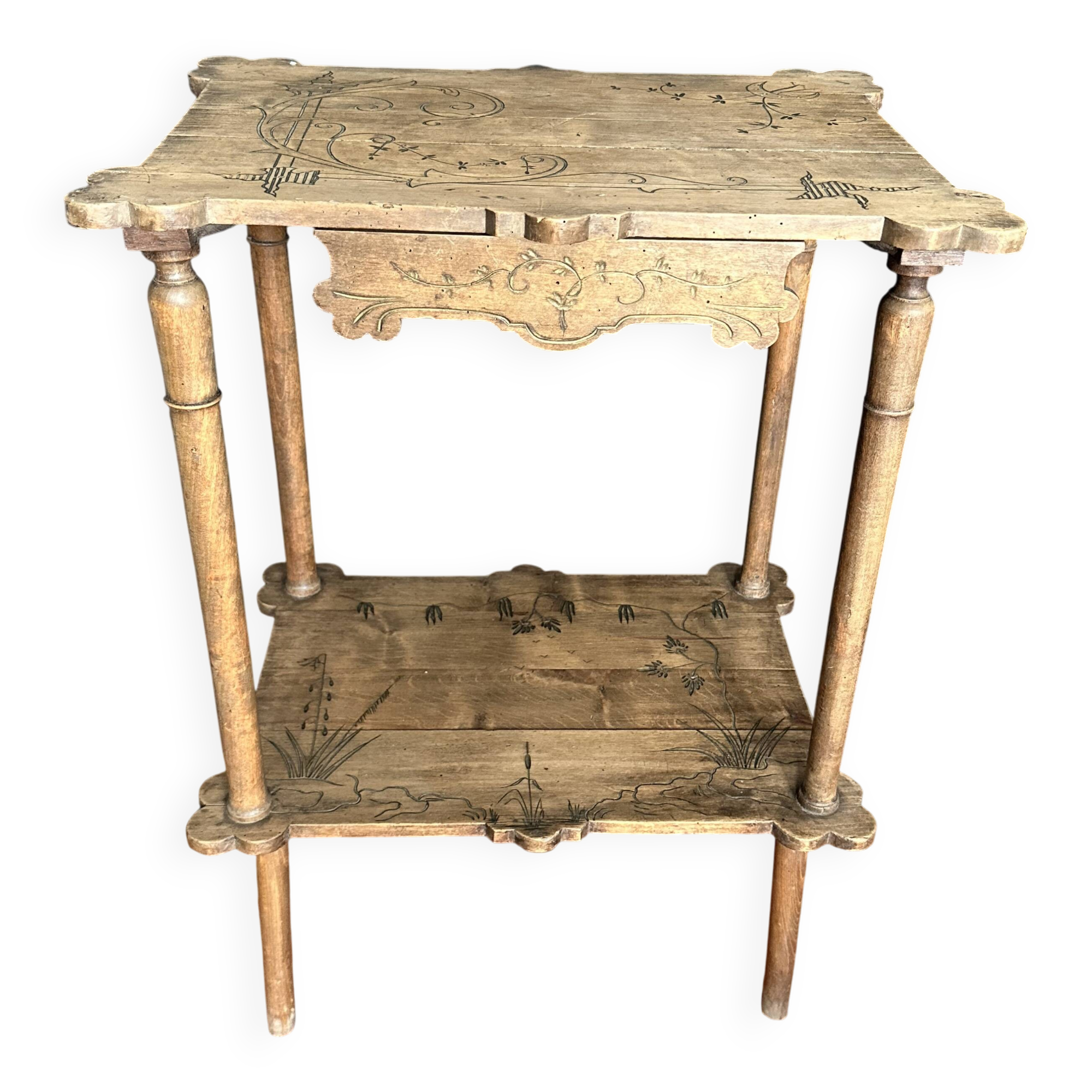 Art Nouveau side table in carved wood with a drawer, circa 1900.