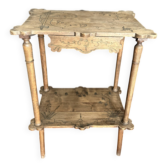 Art Nouveau side table in carved wood with a drawer, circa 1900.