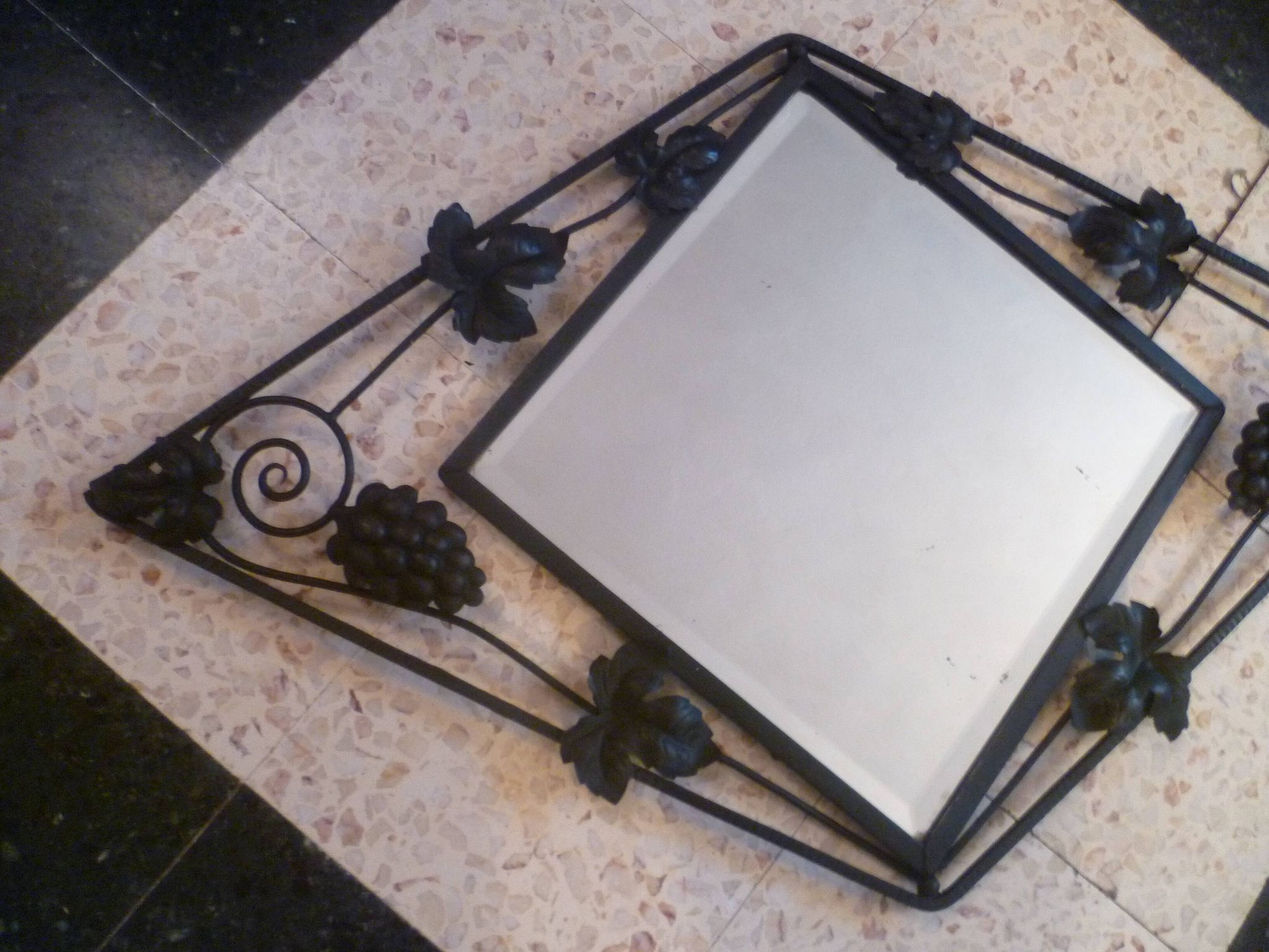 Art deco beveled mirror in wrought iron with grape decor