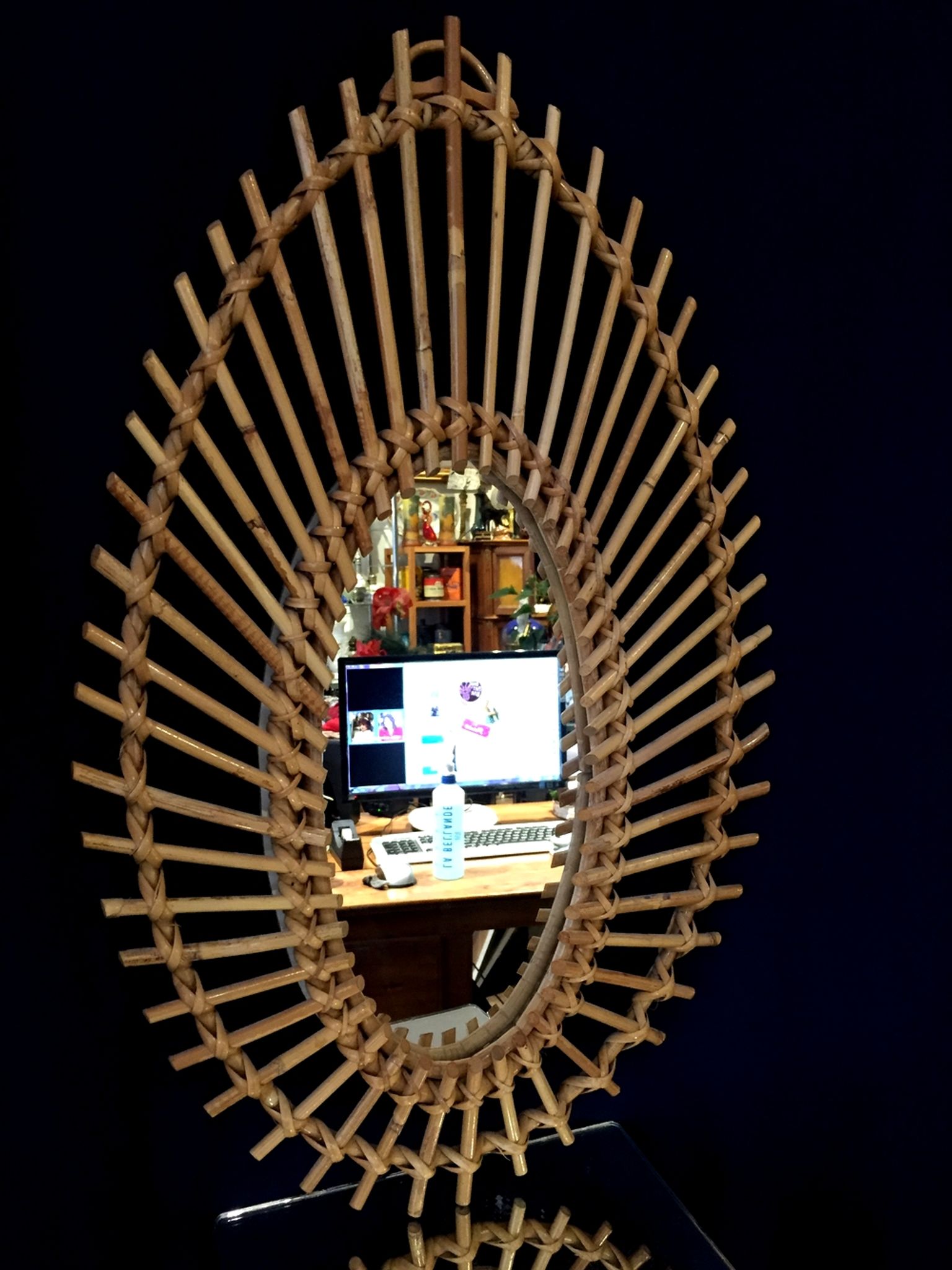 Oval shaped sun mirror in vintage rattan 1960/1970