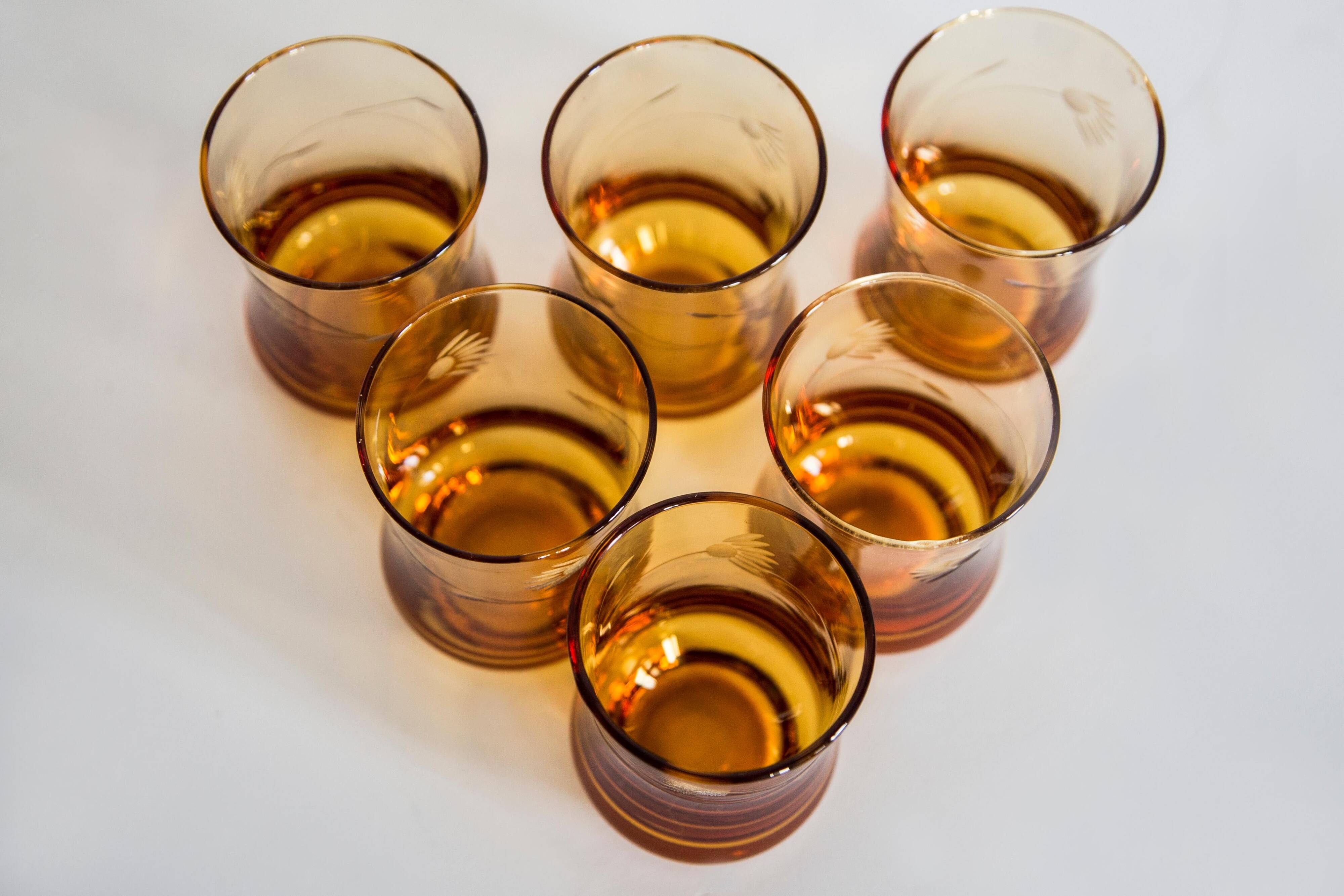 Set of six mid-century glasses and yellow Murano pot, Europe, 1960s.