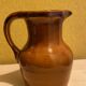 St. Clement brown ceramic pitcher, 1970