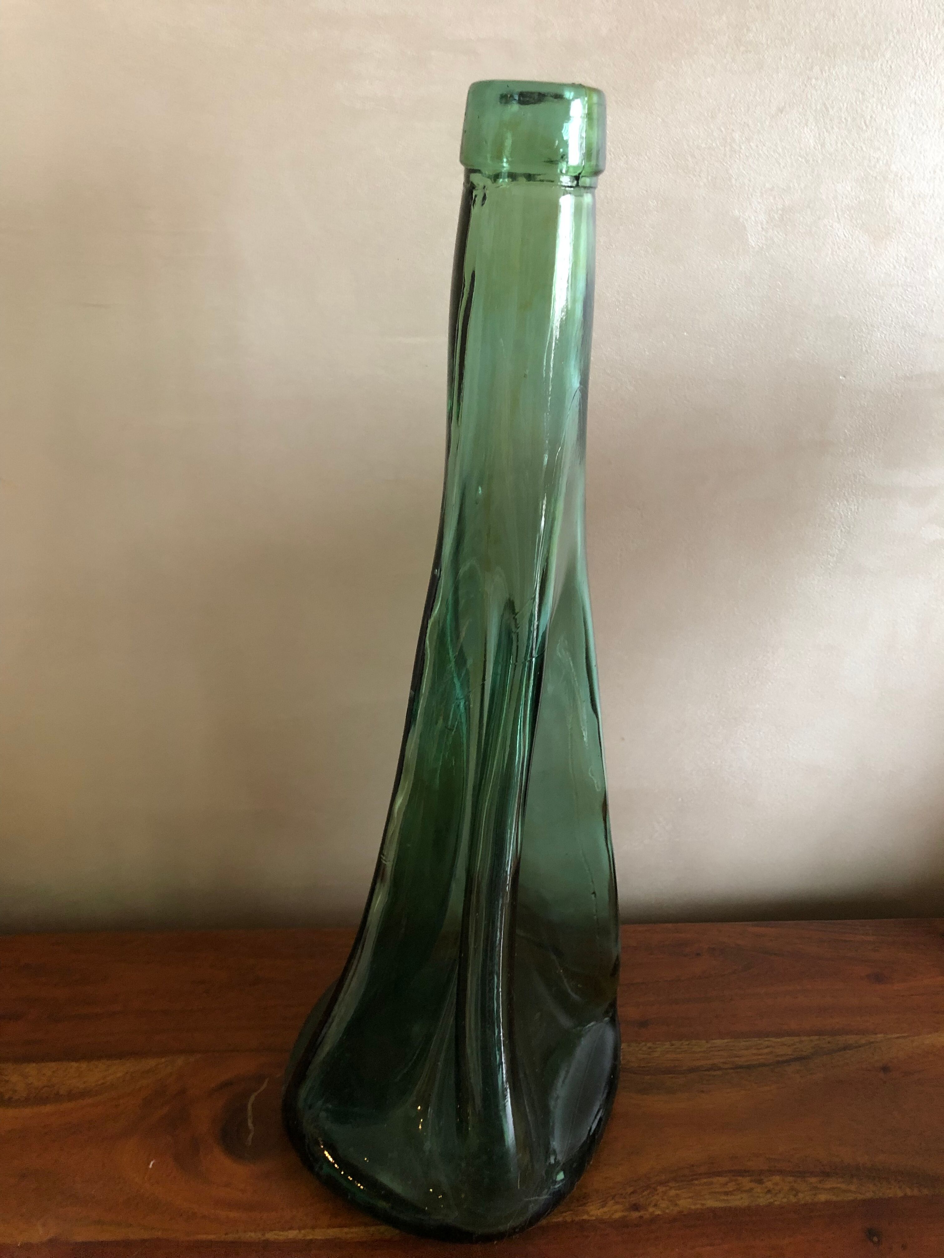Large free-form green blown glass bottle