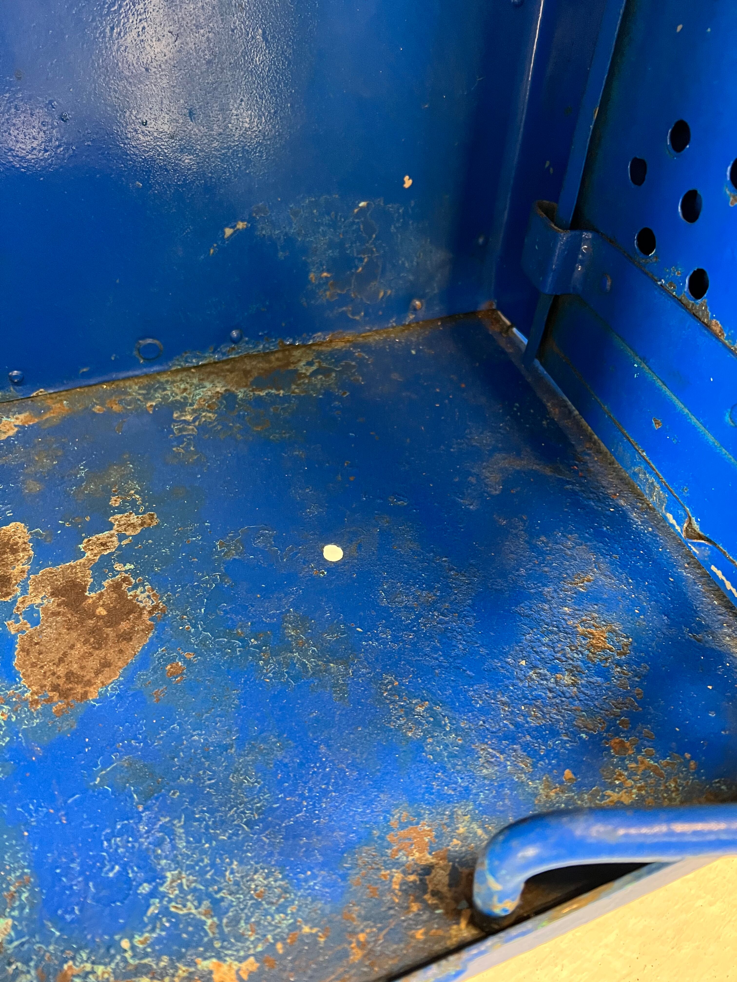 Metal locker with metal rivets