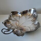 Old empty cut pocket in silver metal art nouveau in the shape of a sheet