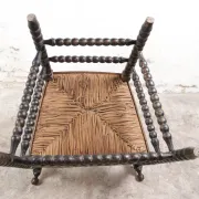 Black bobbin chair with armrests and rush seat – ca. 1900-1930