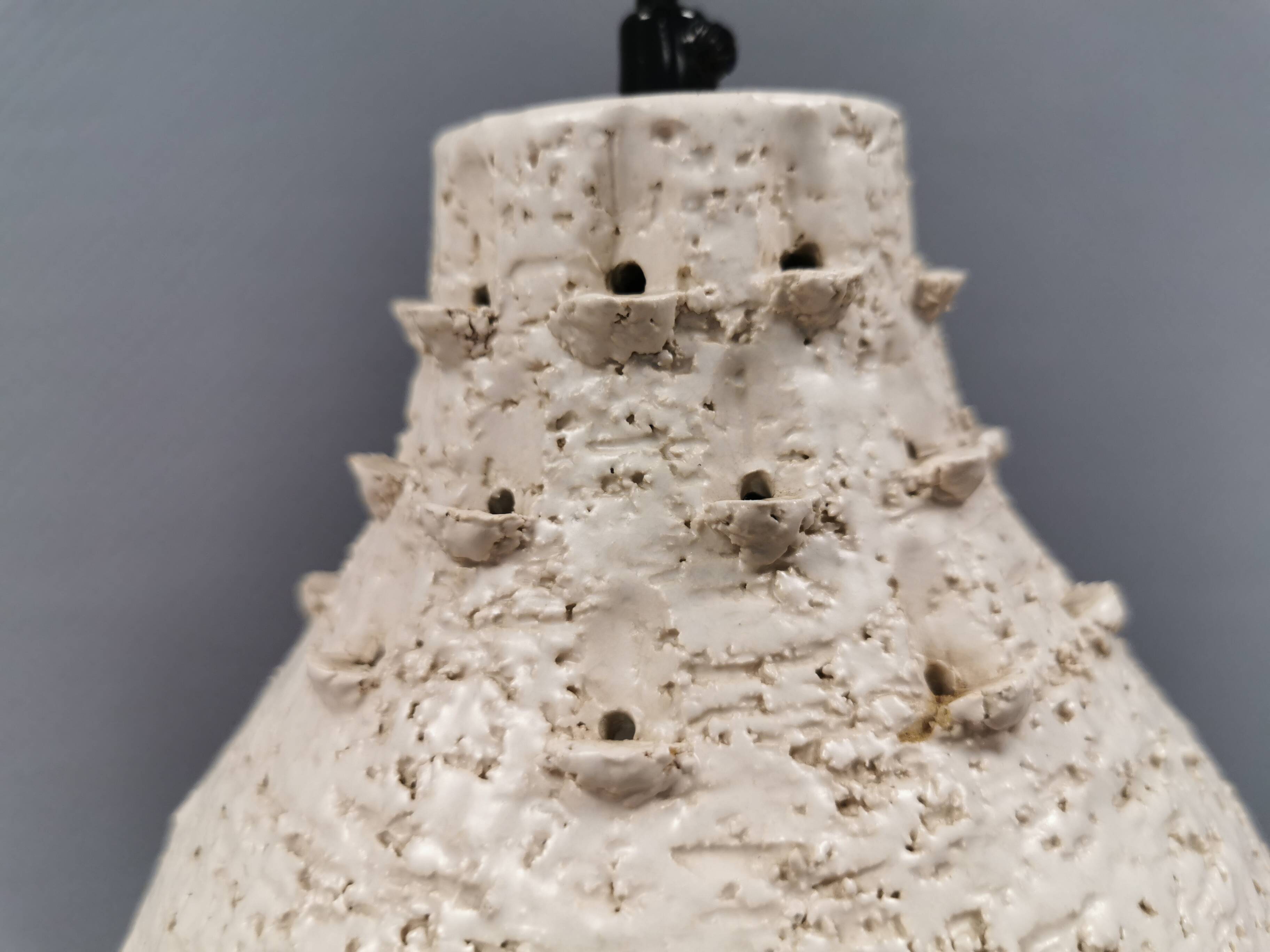 Two ceramic hanging lamps, in creamy white color, looking almost like coral