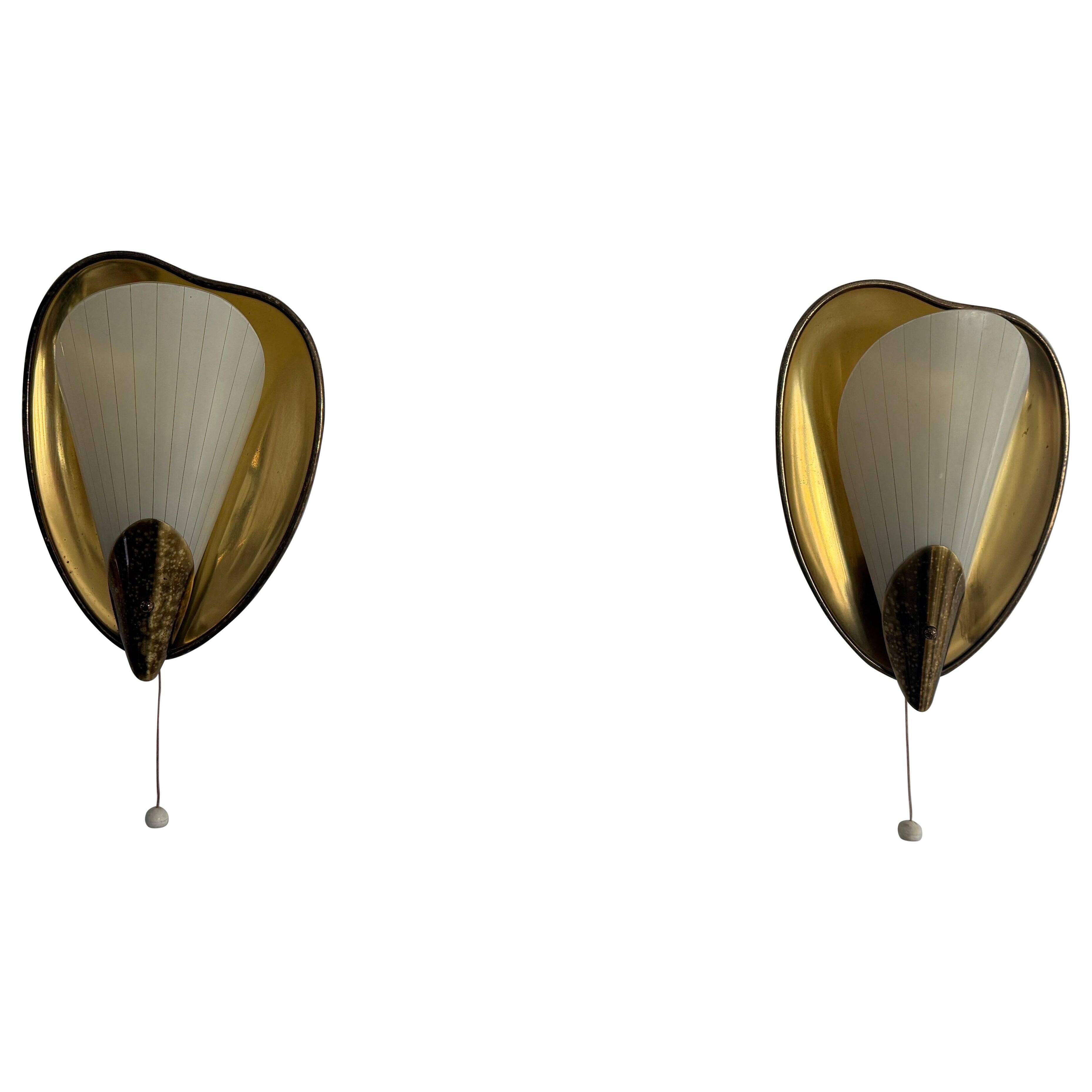 Pair of brass and glass wall lights from the mid-century, 1950s, Germany.