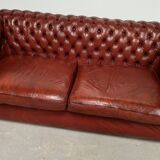 Old red leather Chesterfield sofa