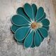 Emerald green rattan and linen flower wall light with 16 petals