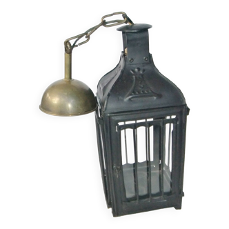 Old chandelier hanging lantern with candle in sheet metal