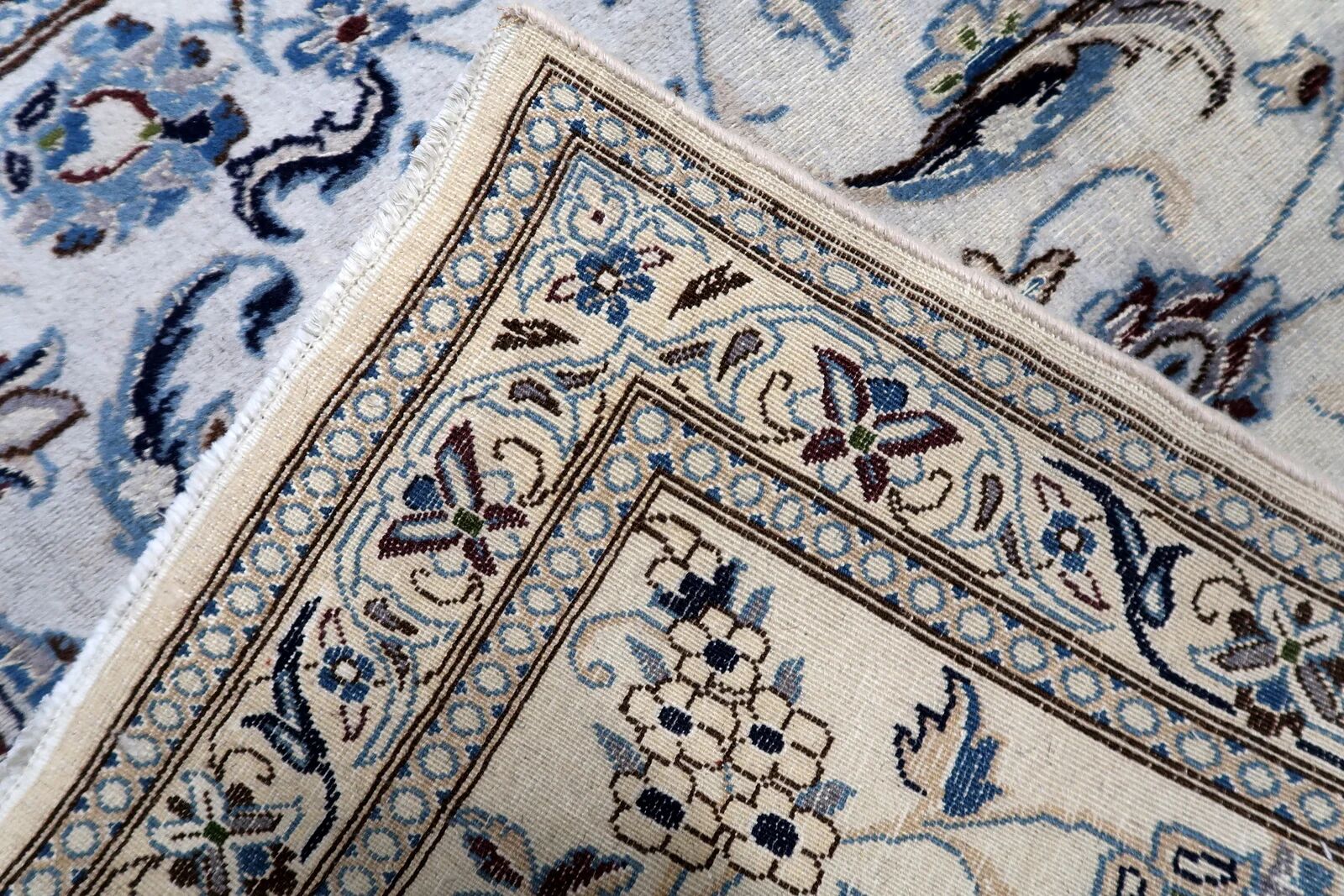 1950s hand-knotted wool rug with silk highlights, ivory and blue, 118 × 200 cm