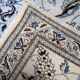 1950s hand-knotted wool rug with silk highlights, ivory and blue, 118 × 200 cm