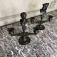 Pair of bronze candlesticks with a black patina in the antique style