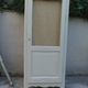 Vintage beige wardrobe made of wood and jute fabric.