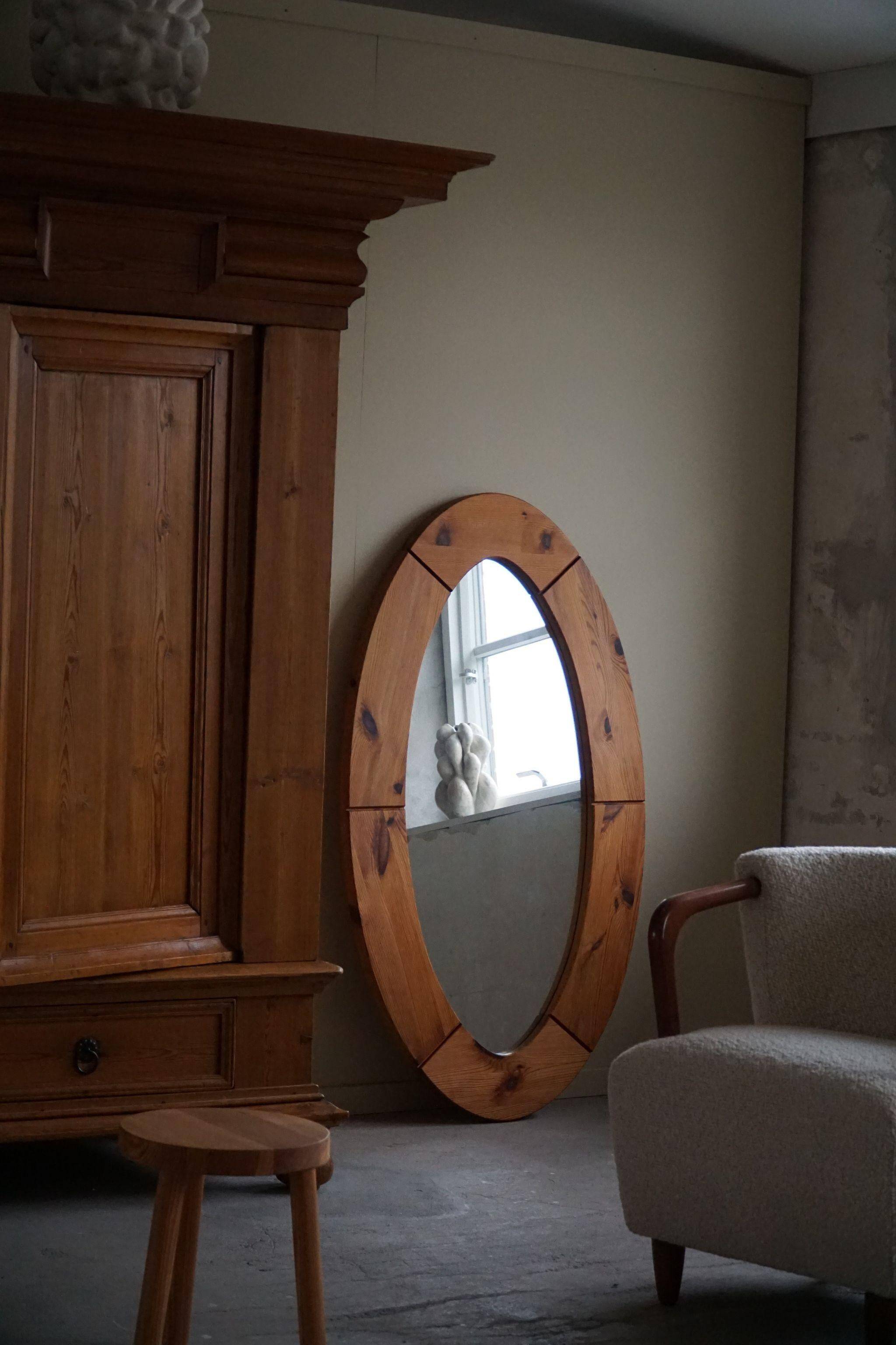 Large oval wall mirror in solid pine by Glasmäster Markaryd, Sweden, 1960s.