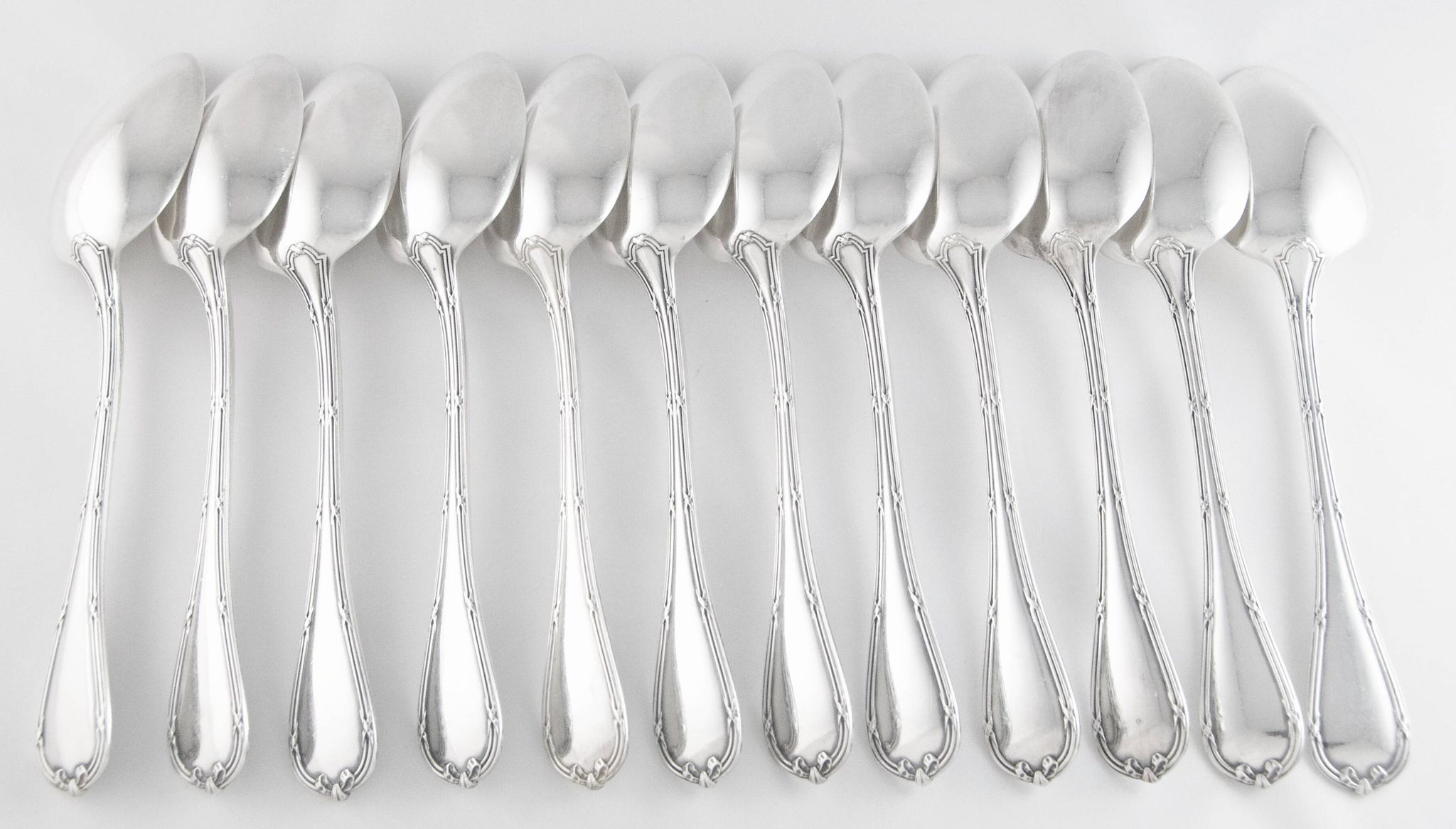 CHRISTOFLE 1907-1935 - 12 table forks and 12 Louis XVI style table spoons, Rubans model