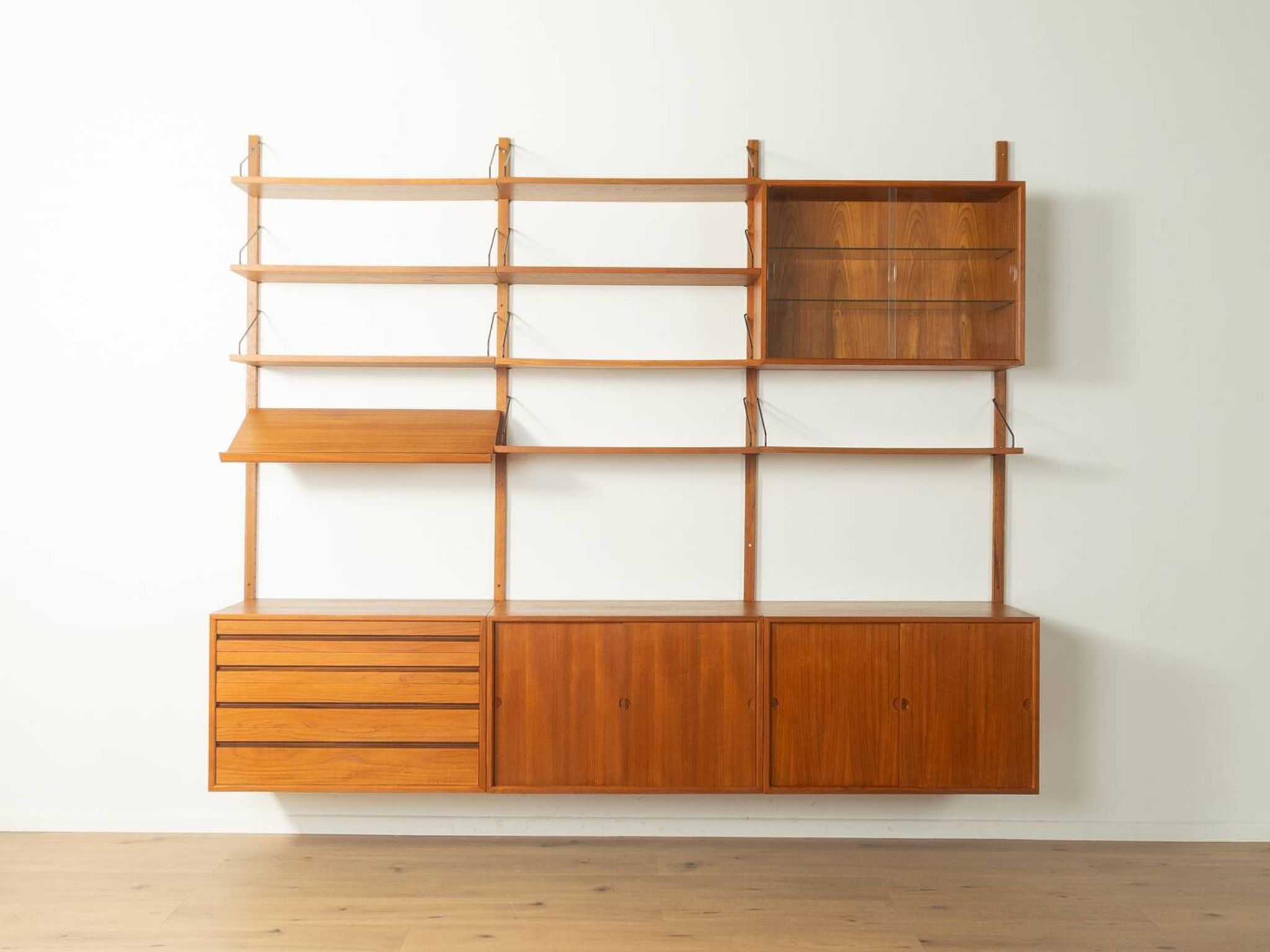 Classic shelving system from the 1960s in teak veneer by Poul Cadovius for Cado