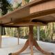 Extendable round dining table with central leg renovated in raw wood 205cm