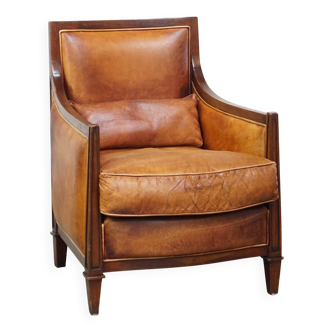 Chaise design Art déco en cuir de mouton couleur cognac associée à du bois