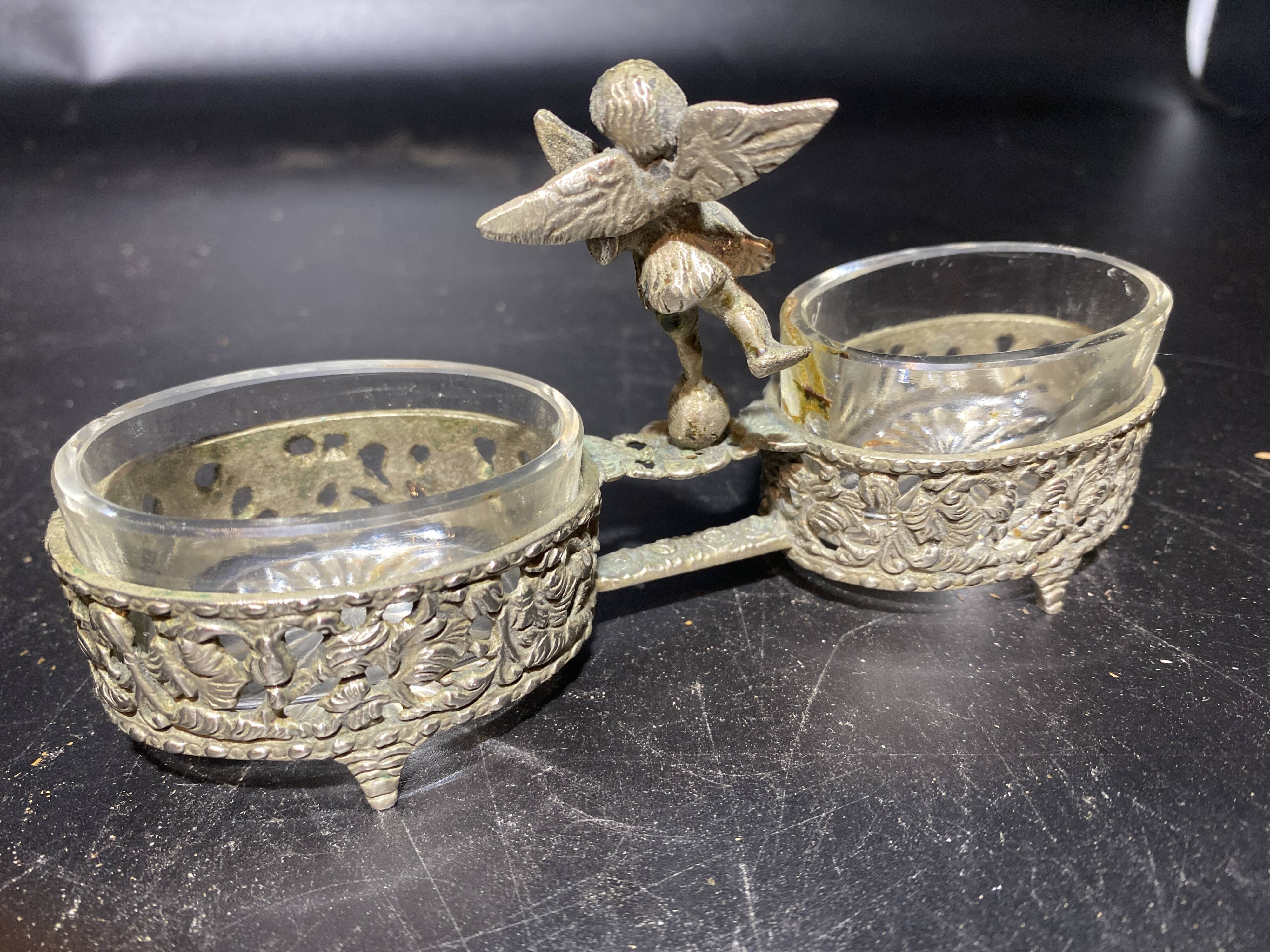Spice centerpiece and serving spoon topped with a brass cherub