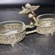 Spice centerpiece and serving spoon topped with a brass cherub