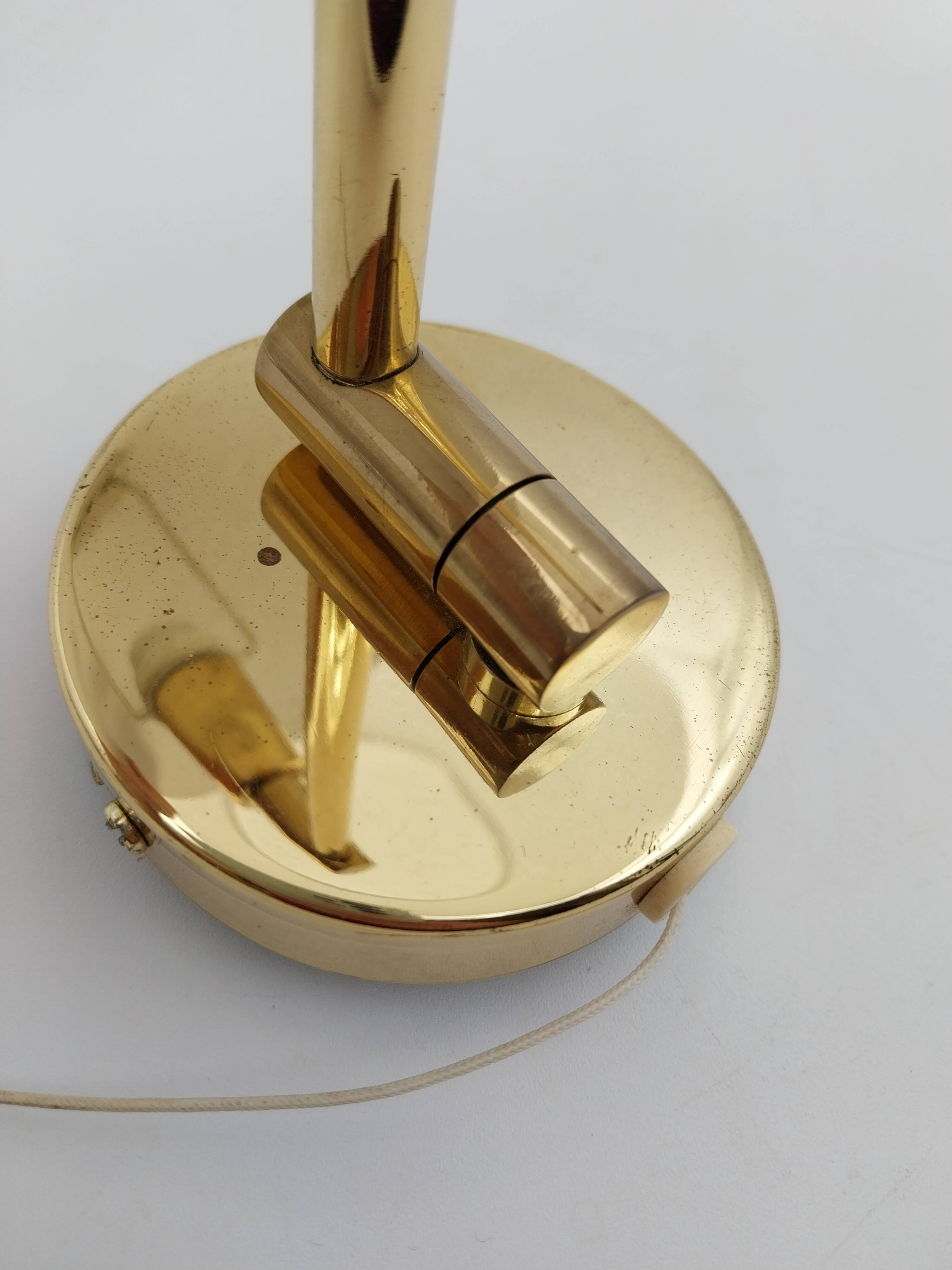 Pair of articulated arm wall lights in brass with opaline globe