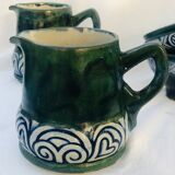 Two cups and two quimper milk jars