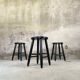 Set of three vintage stools in black lacquered wood.
