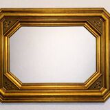 Antique octagonal mirror in gilded wood with painted floral decoration.