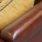 Luxurious and spacious two-seater sheepskin sofa of top quality with fabric cushions