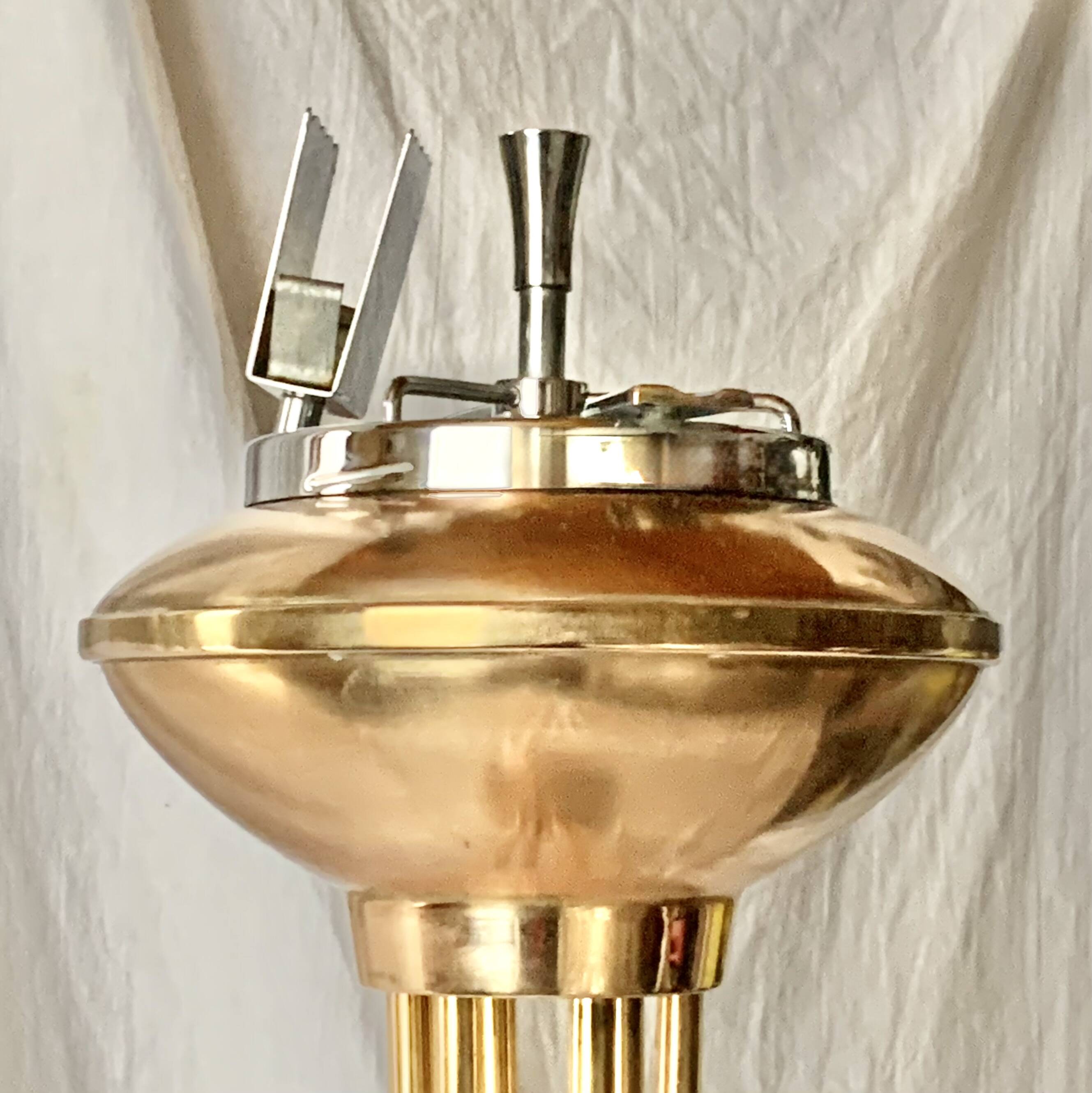 Old brass and chrome-plated metal ashtray on stand