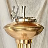 Old brass and chrome-plated metal ashtray on stand