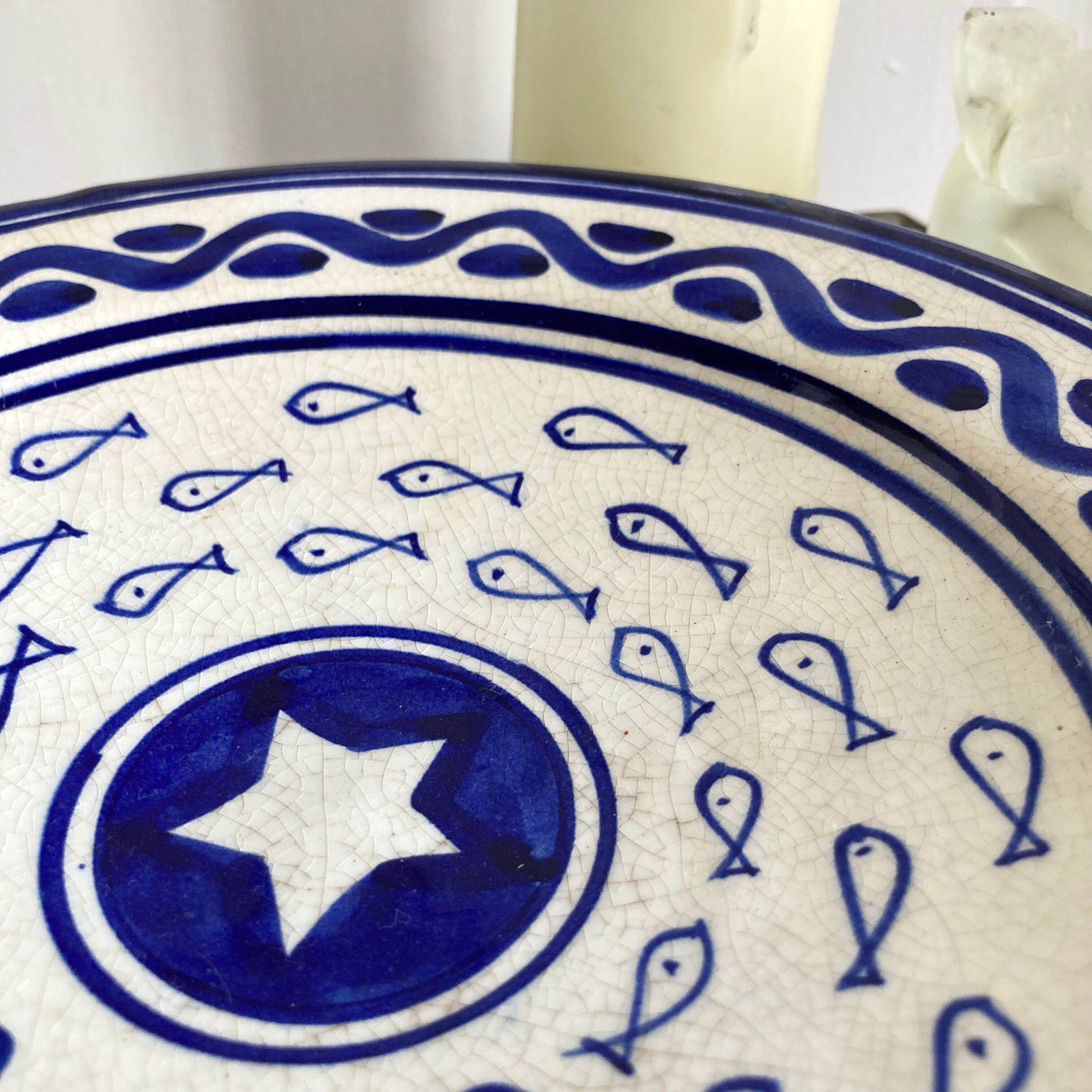 Decorative ceramic deep plate with fish decoration