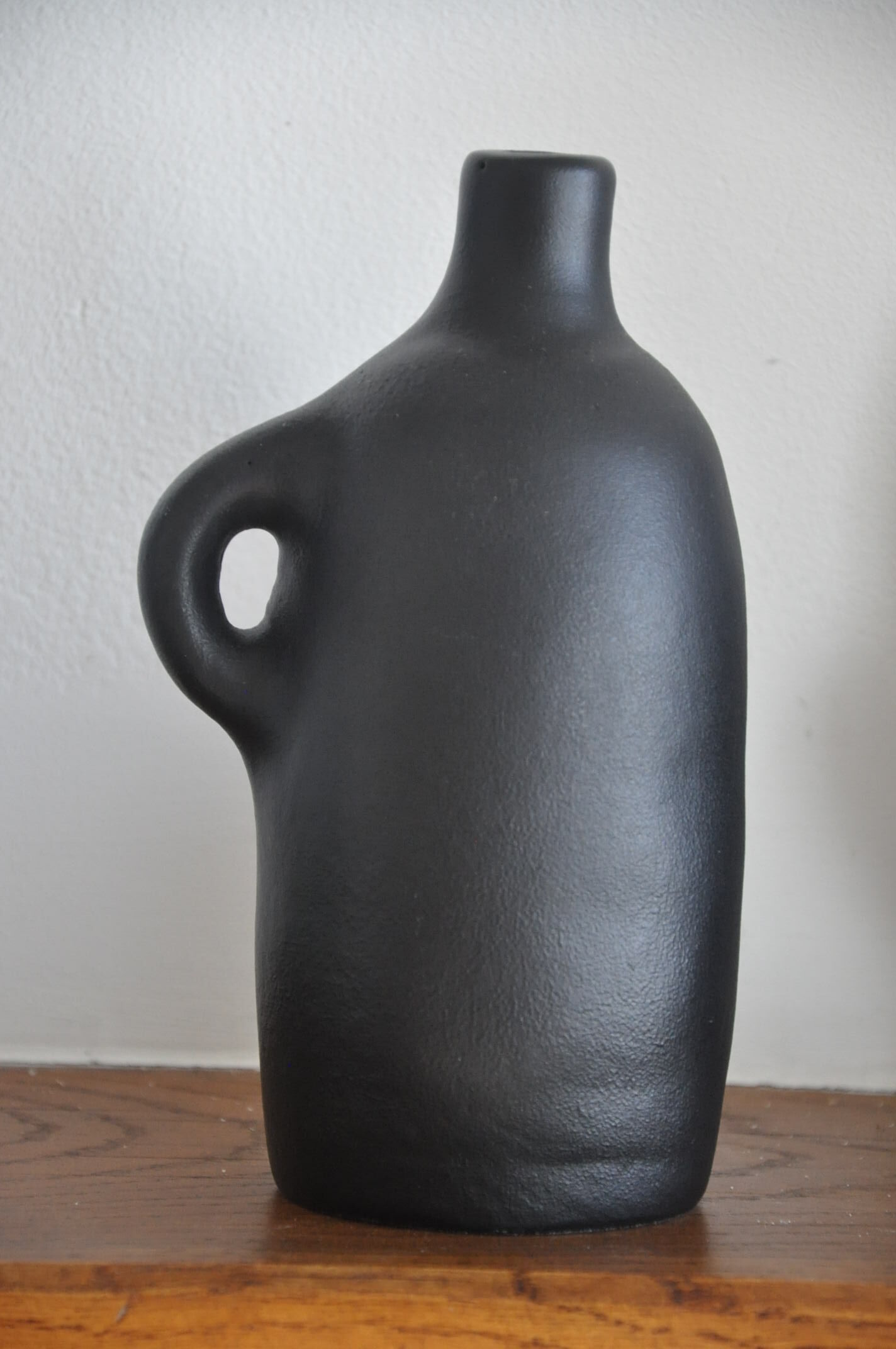 Trio of vintage black vases