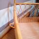 Vintage baby bed in wicker/rotin