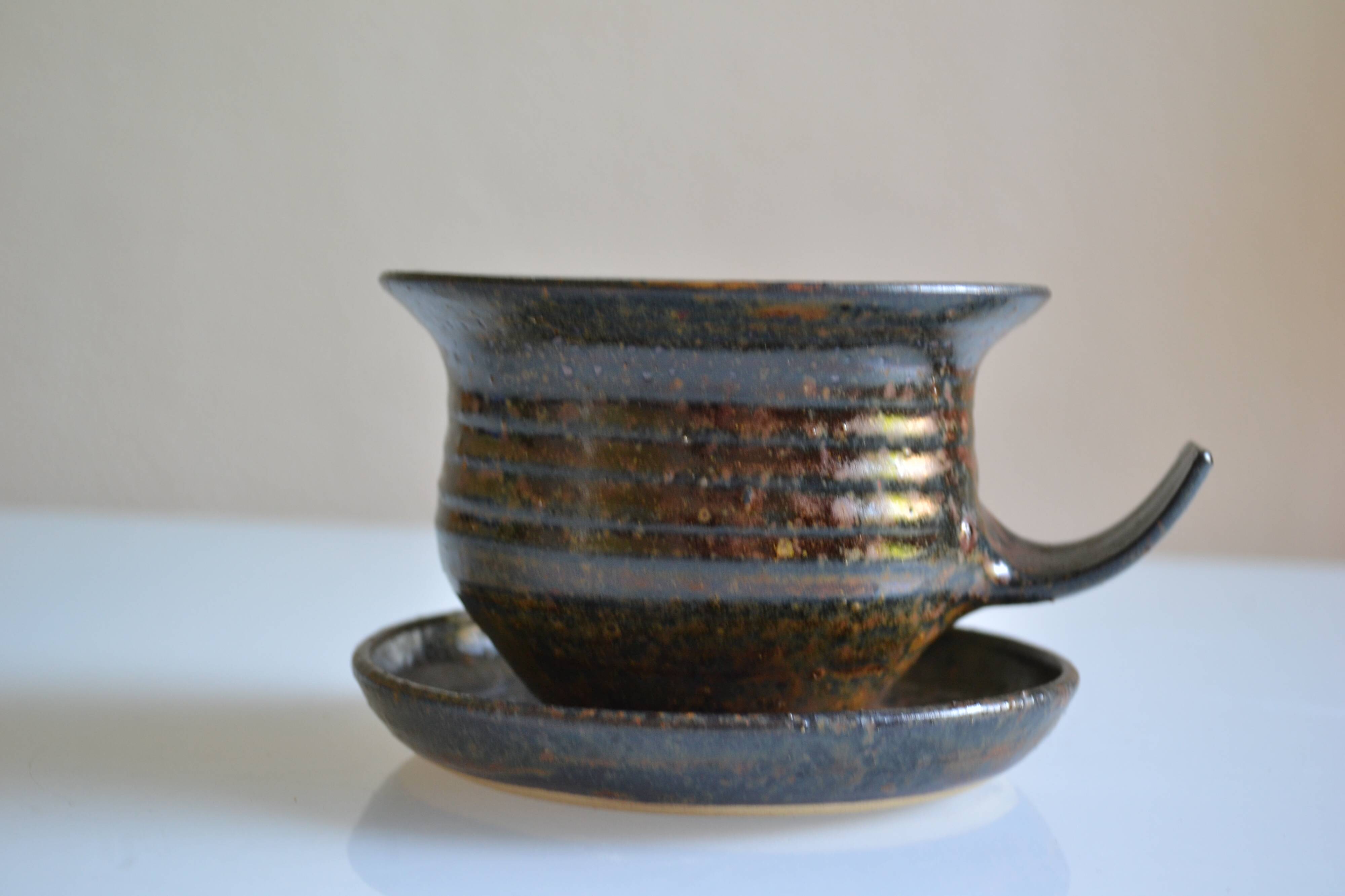 1970s ceramic cup and saucer signed