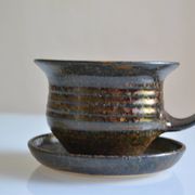 1970s ceramic cup and saucer signed