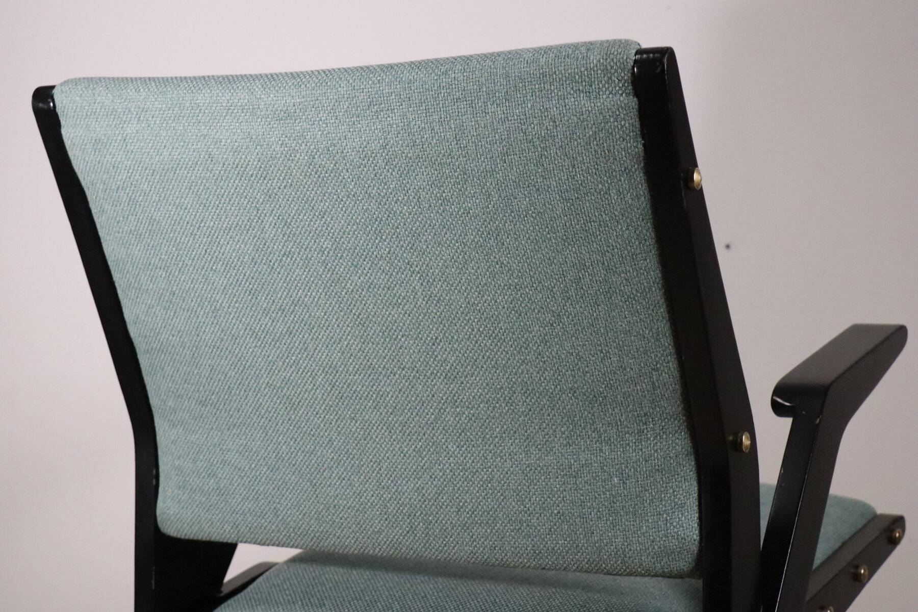 Vintage armchair from the 1960s in black wood and fabric.