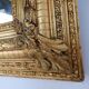 Large gilded wood and stucco mirror with foliage