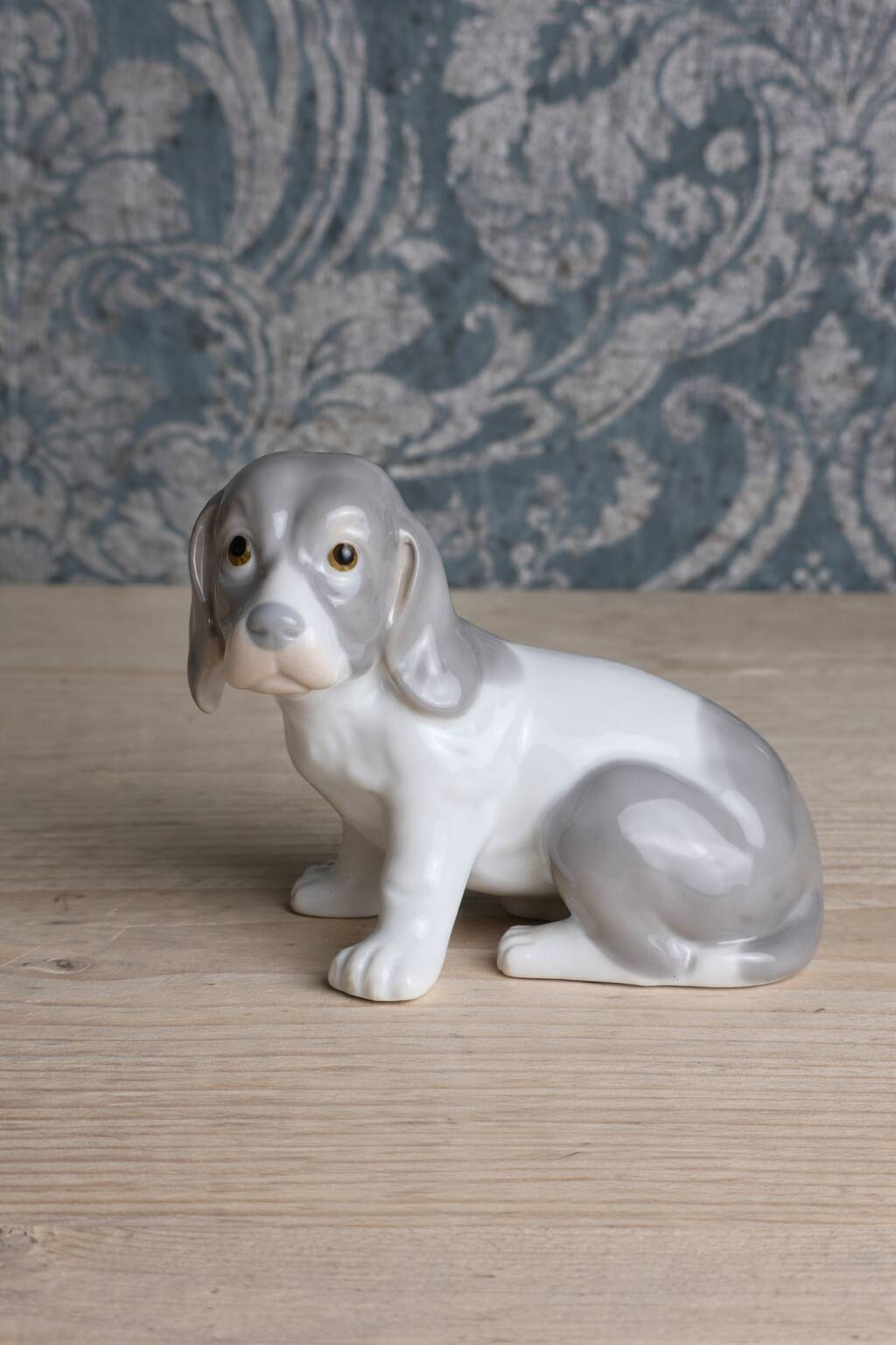 Small spaniel dog in porcelain