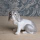 Small spaniel dog in porcelain