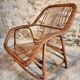 Vintage rattan lounge set, French wicker armchairs and round table, circa 1930–1950.