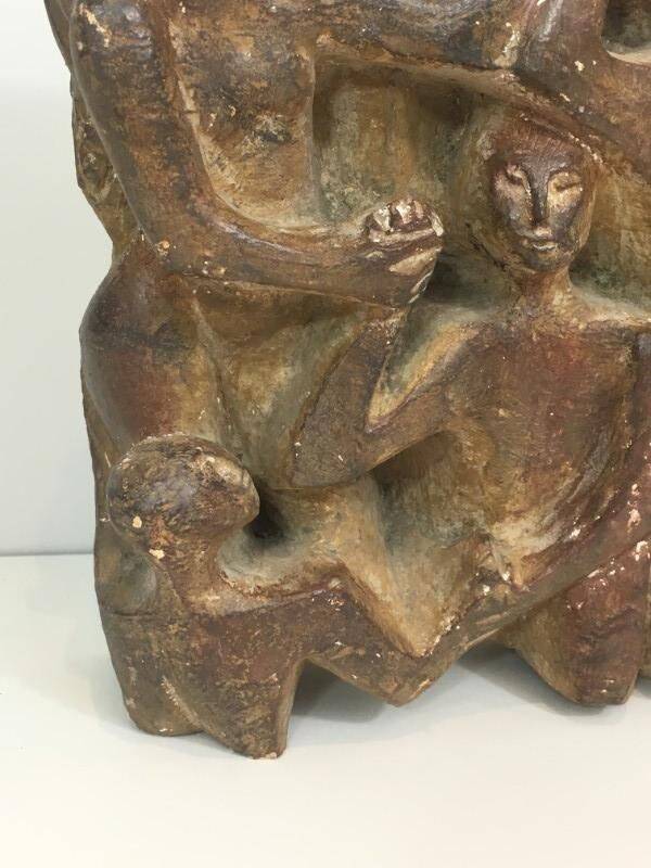 Plaster sculpture depicting a group of 3 figures